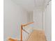 Upstairs hallway with carpet and wooden railing at 1004 Masons Creek Cir # 1004, Atlanta, GA 30350