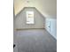 Spacious bedroom with dormer window and carpet at 168 Silvercrest Dr, Acworth, GA 30101