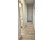 Light-filled hallway with wood-look flooring and access to multiple rooms at 168 Silvercrest Dr, Acworth, GA 30101