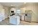 Modern kitchen with white cabinets, island, and stainless steel appliances at 168 Silvercrest Dr, Acworth, GA 30101