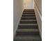 Carpeted staircase leading to the upper level at 168 Silvercrest Dr, Acworth, GA 30101