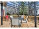 Deck with pergola, table, chairs, and wooded view at 2024 Gramercy Cir, Atlanta, GA 30341