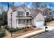 Brick two-story house with attached garage and landscaped front yard at 2024 Gramercy Cir, Atlanta, GA 30341