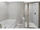 Bathroom with a bathtub and a separate shower stall at 372 Provenance Dr, Sandy Springs, GA 30328