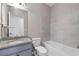 Clean bathroom with granite vanity, tub, and tile surround at 372 Provenance Dr, Sandy Springs, GA 30328