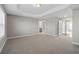 Large bedroom with neutral walls and plush carpeting at 372 Provenance Dr, Sandy Springs, GA 30328