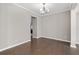 Simple dining room with hardwood floors and chandelier at 372 Provenance Dr, Sandy Springs, GA 30328