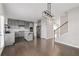 Modern kitchen with gray cabinets, island, and stainless steel appliances at 372 Provenance Dr, Sandy Springs, GA 30328