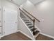 Staircase with dark wood treads and white railing at 372 Provenance Dr, Sandy Springs, GA 30328