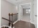 Upstairs hallway with hardwood floors and access to bedroom at 372 Provenance Dr, Sandy Springs, GA 30328