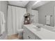 Clean bathroom with a single vanity and shower/tub combo at 45 Highland Park Way, Sharpsburg, GA 30277