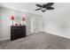 Bright bedroom with grey carpet and ceiling fan at 45 Highland Park Way, Sharpsburg, GA 30277