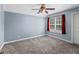 Bedroom with ceiling fan and red curtains at 45 Highland Park Way, Sharpsburg, GA 30277