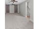 Bonus room with barn doors and neutral color palette at 45 Highland Park Way, Sharpsburg, GA 30277