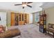 Bonus room with built-in shelving and a ceiling fan at 45 Highland Park Way, Sharpsburg, GA 30277