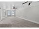 Spacious bonus room with large windows and ceiling fan at 45 Highland Park Way, Sharpsburg, GA 30277