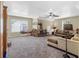 Bonus room with sectional sofa and built-in shelving at 45 Highland Park Way, Sharpsburg, GA 30277