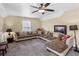 Bonus room with sectional sofa and ceiling fan at 45 Highland Park Way, Sharpsburg, GA 30277