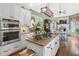 Eat-in kitchen with island and view into breakfast nook at 45 Highland Park Way, Sharpsburg, GA 30277