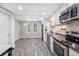 Modern kitchen with stainless steel appliances and tile floor at 45 Highland Park Way, Sharpsburg, GA 30277