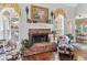 Cozy living room with a brick fireplace and cowhide print armchairs at 45 Highland Park Way, Sharpsburg, GA 30277