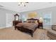 Luxurious main bedroom with large bed and ensuite bath at 45 Highland Park Way, Sharpsburg, GA 30277