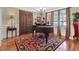 Elegant music room with grand piano and ornate rug at 45 Highland Park Way, Sharpsburg, GA 30277