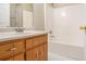 Bathroom with tub, vanity, and updated flooring at 80 Valley Dr, Stockbridge, GA 30281