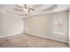 Spacious bedroom with ceiling fan and neutral carpeting at 80 Valley Dr, Stockbridge, GA 30281