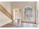 Two-story foyer with hardwood floors, neutral walls, and an arched window at 80 Valley Dr, Stockbridge, GA 30281