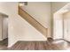 Hardwood floor living room with staircase and front door at 80 Valley Dr, Stockbridge, GA 30281