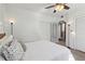 Spacious bedroom with a queen bed, built-in shelving, and access to a bathroom at 856 Briarcliff Ne Rd # 25, Atlanta, GA 30306