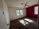 Bedroom with brown carpet, window and one wall painted at 2369 Christian Cir, Covington, GA 30016