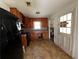 Small kitchen with wood cabinets and black appliances at 2369 Christian Cir, Covington, GA 30016