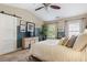 Bright bedroom featuring a barn door, large windows, and a neutral color palette at 4693 Creekside Villas Se Way, Smyrna, GA 30082