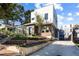 Modern two-story home with brick and wood siding, landscaped yard, and driveway at 522 Boulevard Ne Pl # 1, Atlanta, GA 30308