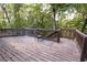 Wooden deck overlooking wooded backyard with seating at , Suwanee, GA 30024