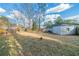 View of backyard, tree stump and single story house at 2802 Mcafee Rd, Decatur, GA 30032