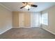 Bright bedroom featuring ceiling fan, plush carpet, neutral paint, and closet at 2802 Mcafee Rd, Decatur, GA 30032