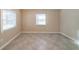 Bedroom with two windows and tiled floors provides a bright and durable living space at 2802 Mcafee Rd, Decatur, GA 30032