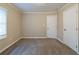 Bedroom featuring carpet flooring, neutral walls and a window offering plenty of natural light at 2802 Mcafee Rd, Decatur, GA 30032