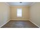 Cozy bedroom featuring carpet floors and a bright window providing natural light at 2802 Mcafee Rd, Decatur, GA 30032