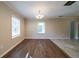 Dining room featuring hardwood floors, two windows and modern lighting at 2802 Mcafee Rd, Decatur, GA 30032