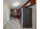 Bright kitchen features stainless steel appliances, modern cabinetry, and ceramic tile flooring at 2802 Mcafee Rd, Decatur, GA 30032