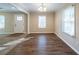 Inviting living room with hardwood floors, a door to the backyard and a ceiling fan at 2802 Mcafee Rd, Decatur, GA 30032