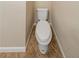 Enclosed view of a standard toilet with vinyl flooring at 2802 Mcafee Rd, Decatur, GA 30032
