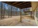 View from a back porch with a large yard and mature trees, perfect for enjoying the outdoors at 4741 W Lake Se Dr, Conyers, GA 30094