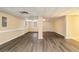Spacious basement features new laminate flooring and neutral walls at 4741 W Lake Se Dr, Conyers, GA 30094