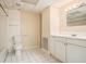 Bathroom featuring a toilet, sink, vanity with storage and a large mirror, perfect for daily routines at 4741 W Lake Se Dr, Conyers, GA 30094