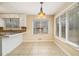 Bright breakfast nook with tile flooring, neutral walls, and many windows for natural light at 4741 W Lake Se Dr, Conyers, GA 30094